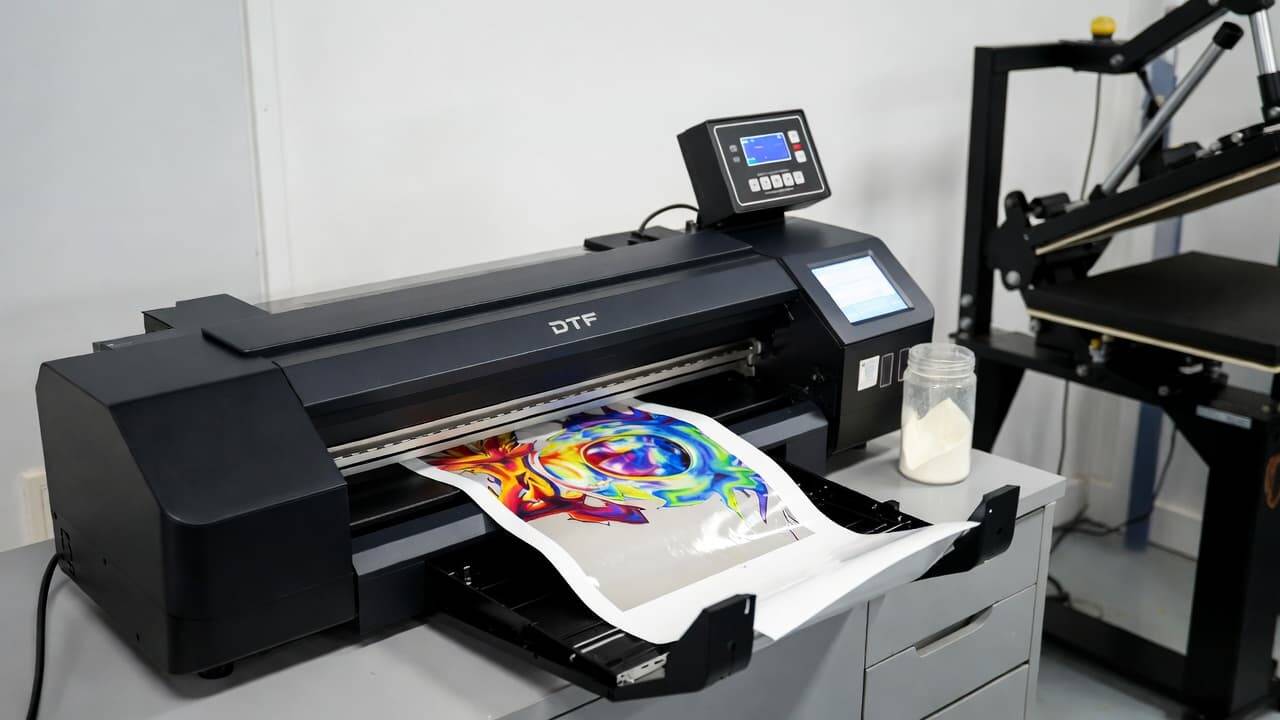 Inkjet printer converted for DTF printing with transfer film and heat press machine setup