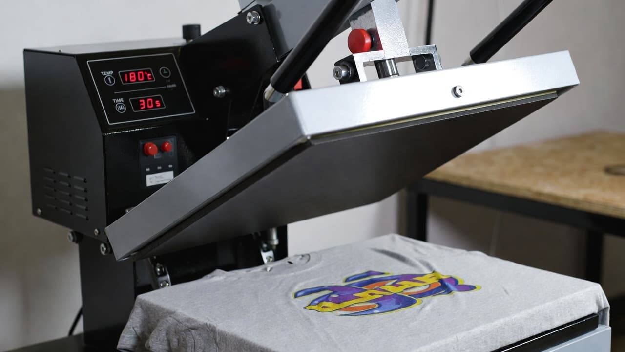 Heat press machine curing a printed garment
