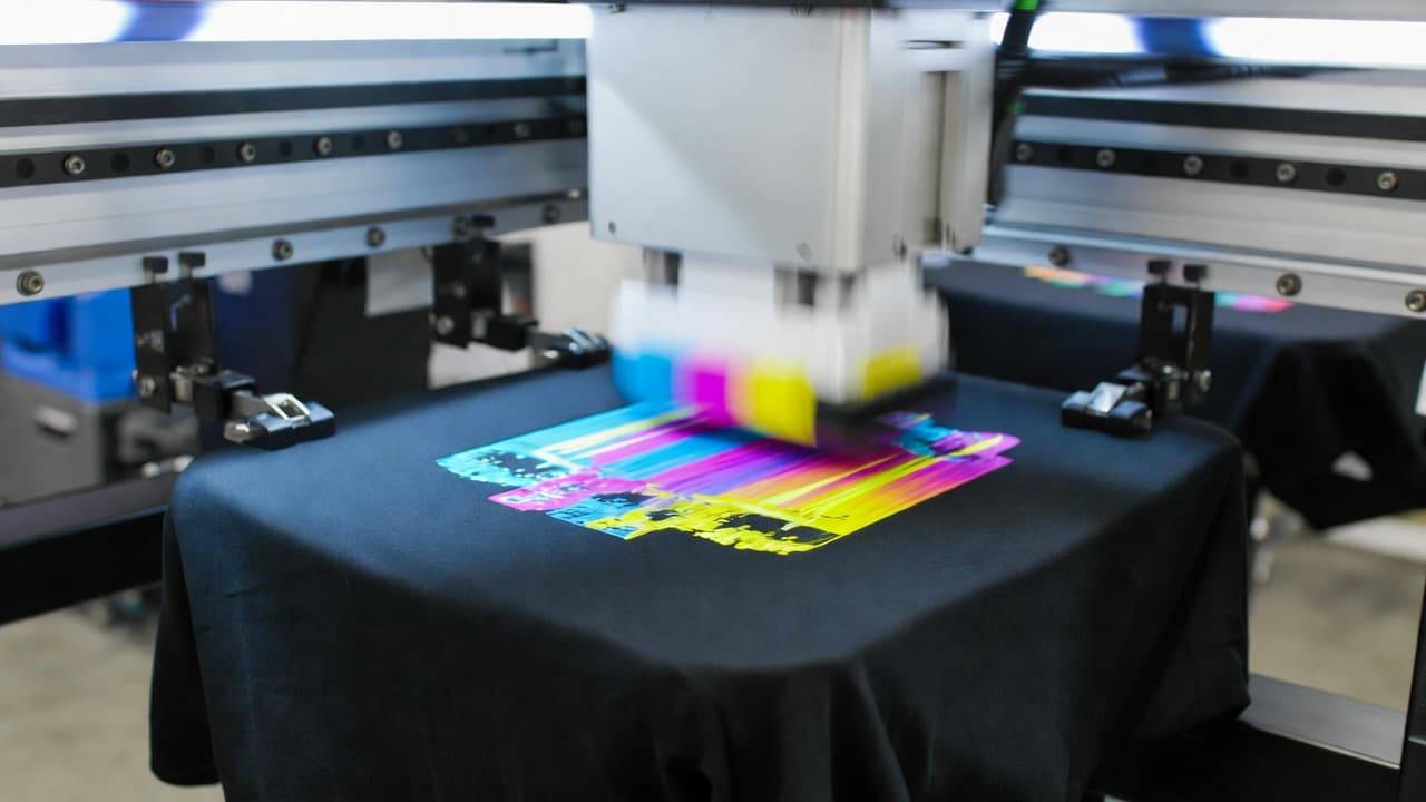 DTG printer printing a colorful high-resolution t-shirt design using advanced print head technology