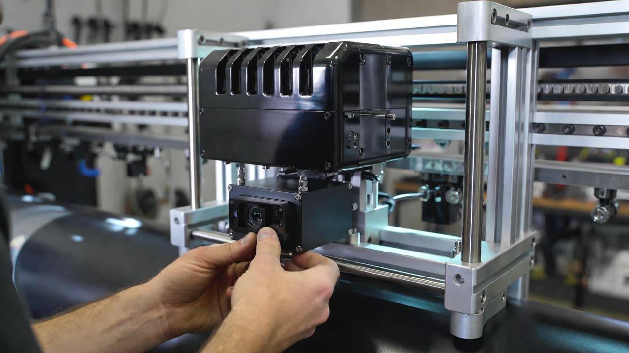 UV printer technician calibrating visual positioning camera system